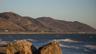 Waves breaking below dry coastal hills on the Pacific coast at Ventura, California. Photo: Tony Webster via Wikimedia Commons, CC BY 2.0 (cropped)