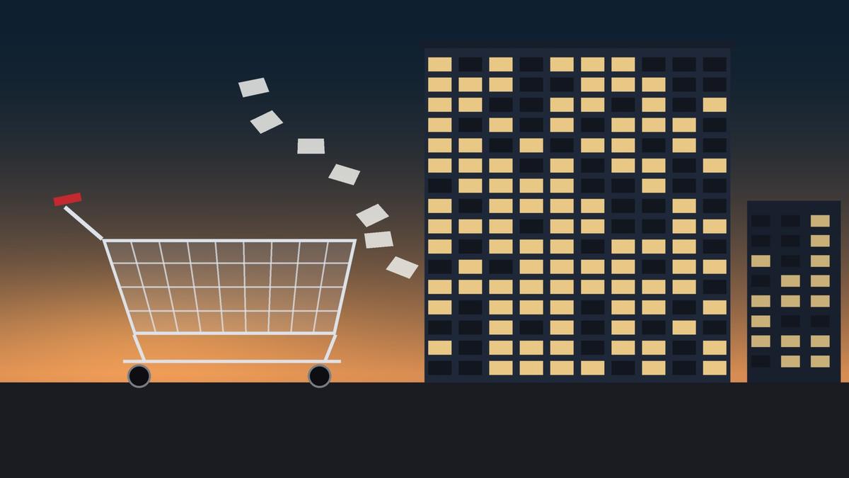 Illustration of an empty wire shopping cart at dusk beside an office tower where about a third of the lit windows have gone dark, with loose papers drifting between them. Illustration: TradeFlock USA