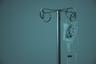 IV fluid bag hanging from a stainless steel infusion stand. Photo: Marcelo Leal on Unsplash
